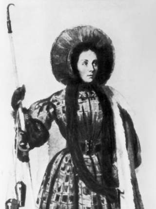 Schwarz-weiß-Kostümzeichnung einer Frau in traditioneller, gemusterter Kleidung mit weitem Rock, langer Stola und großem Hut, die einen langen Stock hält.