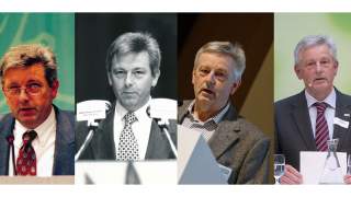 Josef Klenner und Ludwig Wucherpfennig bei der Hauptversammlung in Osnabrück. Zwei Männer in Anzügen schütteln Hände und lächeln in die Kamera.