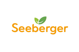 Logo mit dem Schriftzug „Seeberger“ in orange und zwei grünen Blättern über dem Buchstaben „g“.